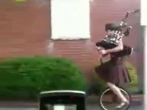 Unicyclist in kilt plays Star Wars theme on Bagpipes Unicyclist in kilt plays Star Wars theme on Bagpipes