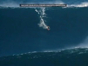 surfs 90 foot wave surfs 90 foot wave