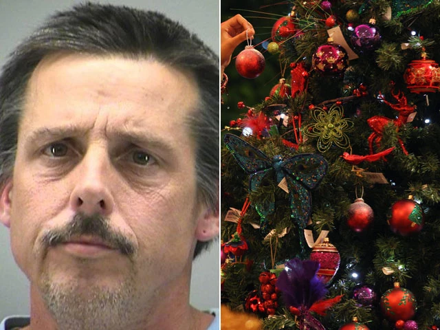 Terry Trent decorates Christmas tree after breaking in Terry Trent decorates Christmas tree after breaking in