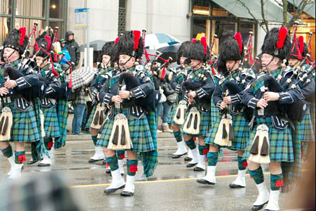 bagpipers marching in a parade bagpipers marching in a parade