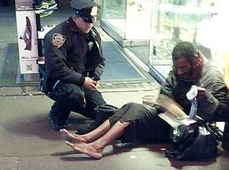 Police officer giving boots to homeless man Police officer giving boots to homeless man