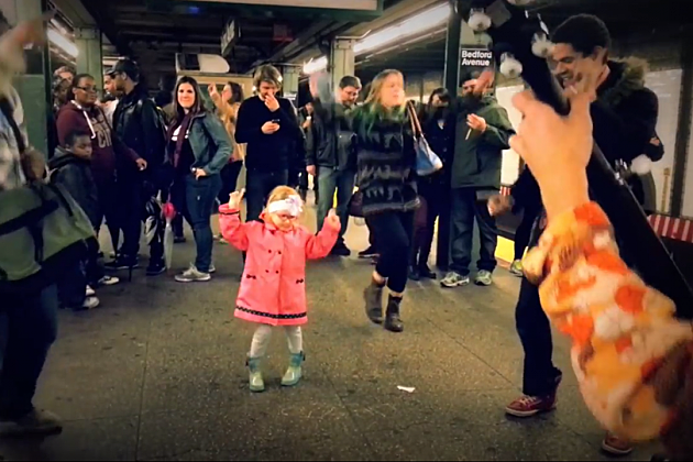 little girl pink jacket subway dancing